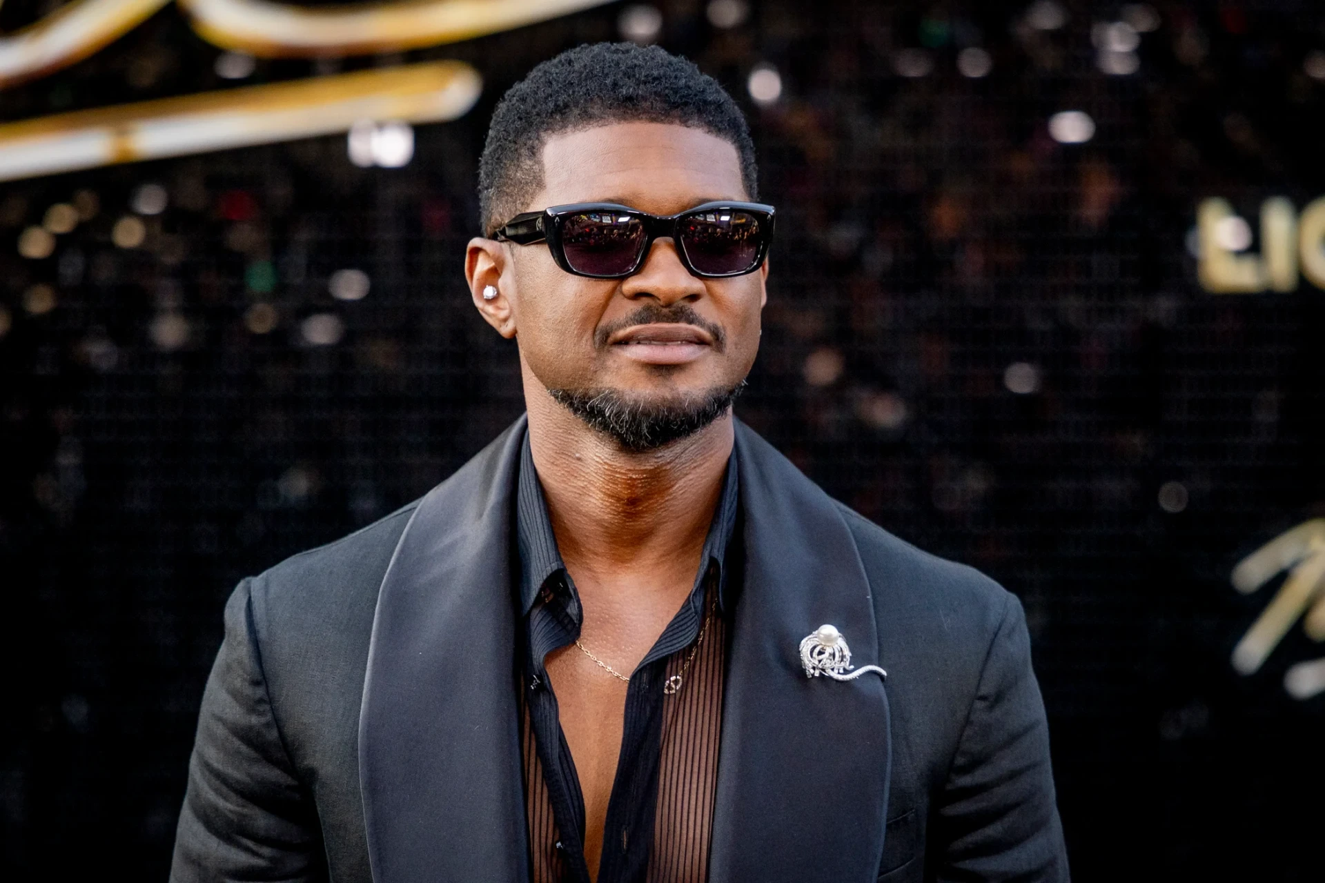 Usher Fires Back After Awkward Stage Moment